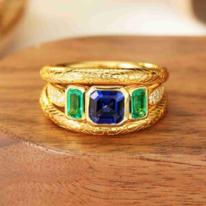 emerald three stone ring