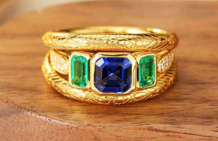 emerald three stone ring